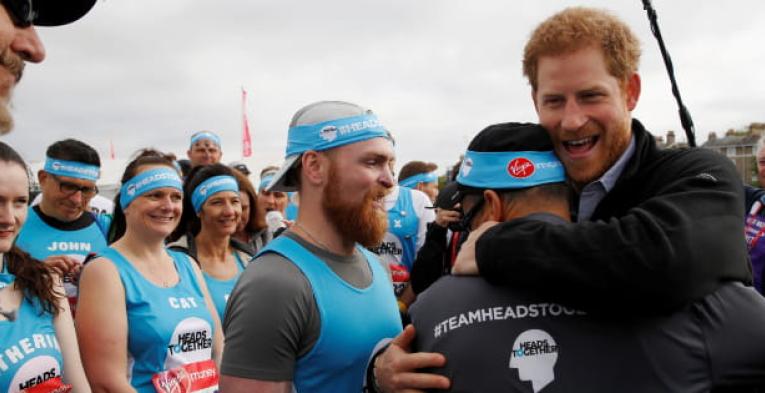 Duke of Sussex hugs a participant